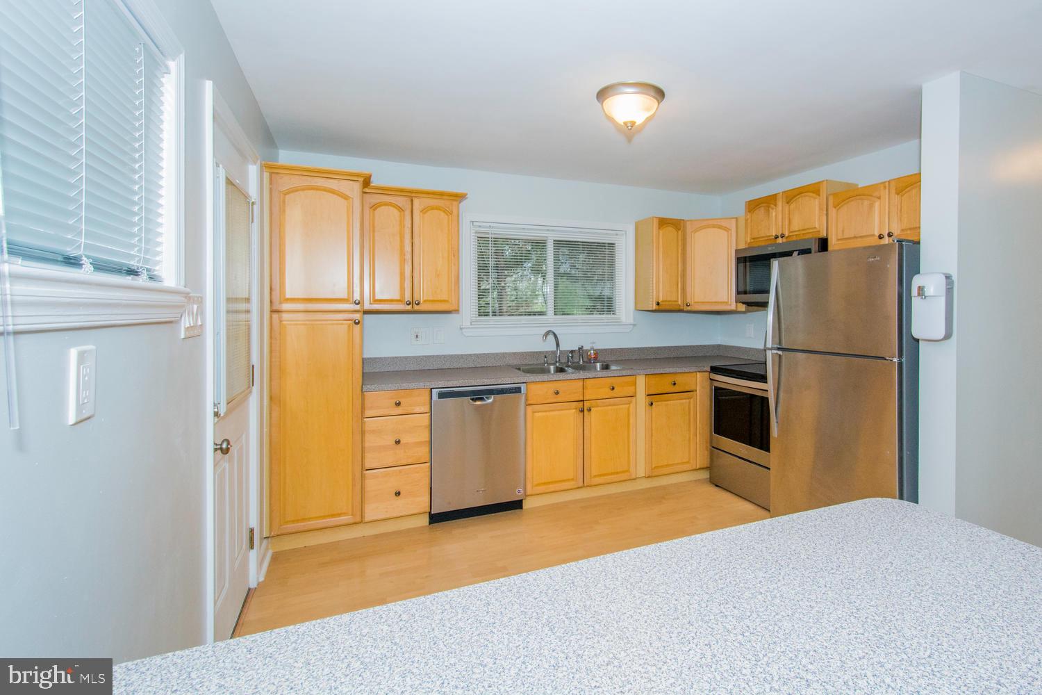 7732 West A W Shore Road Pasadena, MD 21122 - Photo 10 of 43 New Kitchen with Stainless Steel Appliances