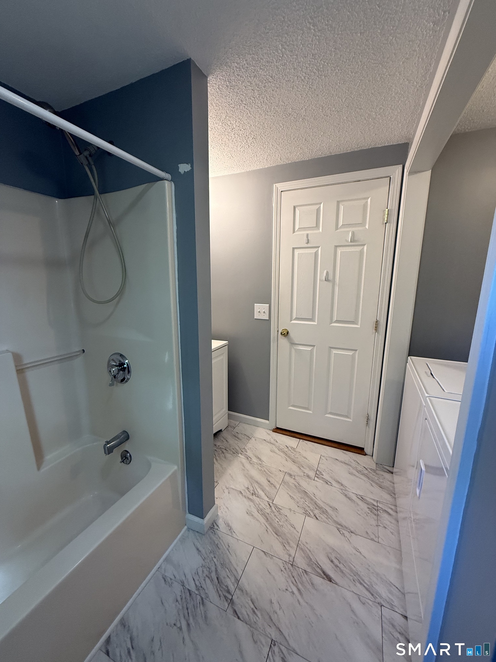 808 East Main Street Torrington, CT 06790 - Photo 31 of 40 a bathroom with a tub and a shower