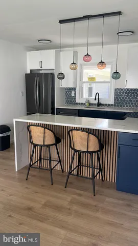 a kitchen with a sink and a stove