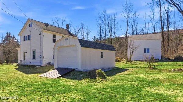 a view of a back yard of the house