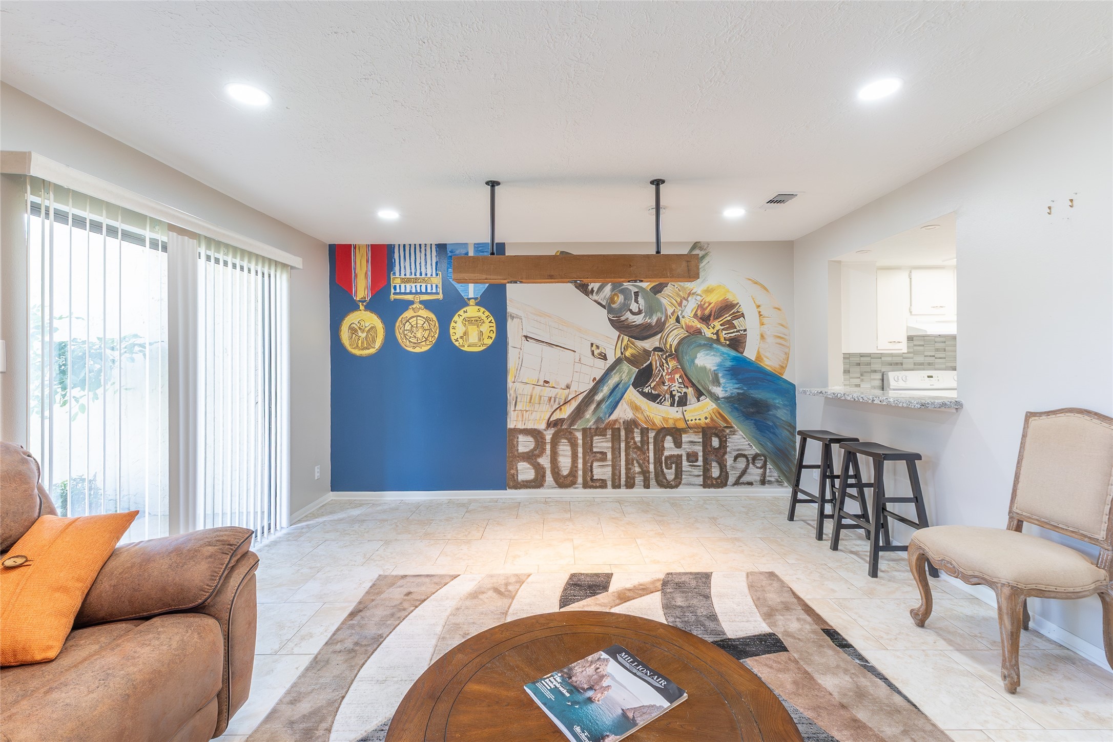 38 Regency Point Montgomery, TX 77356 - Photo 8 of 49 mural, front door on the left, breakfast bar and kitchen on the right, family room on foreground.