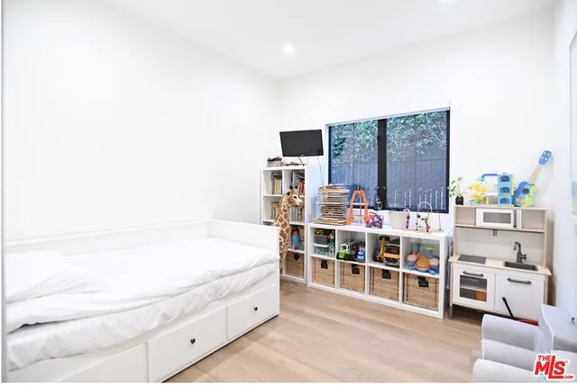 a spacious bathroom with a double vanity sink and a bathtub