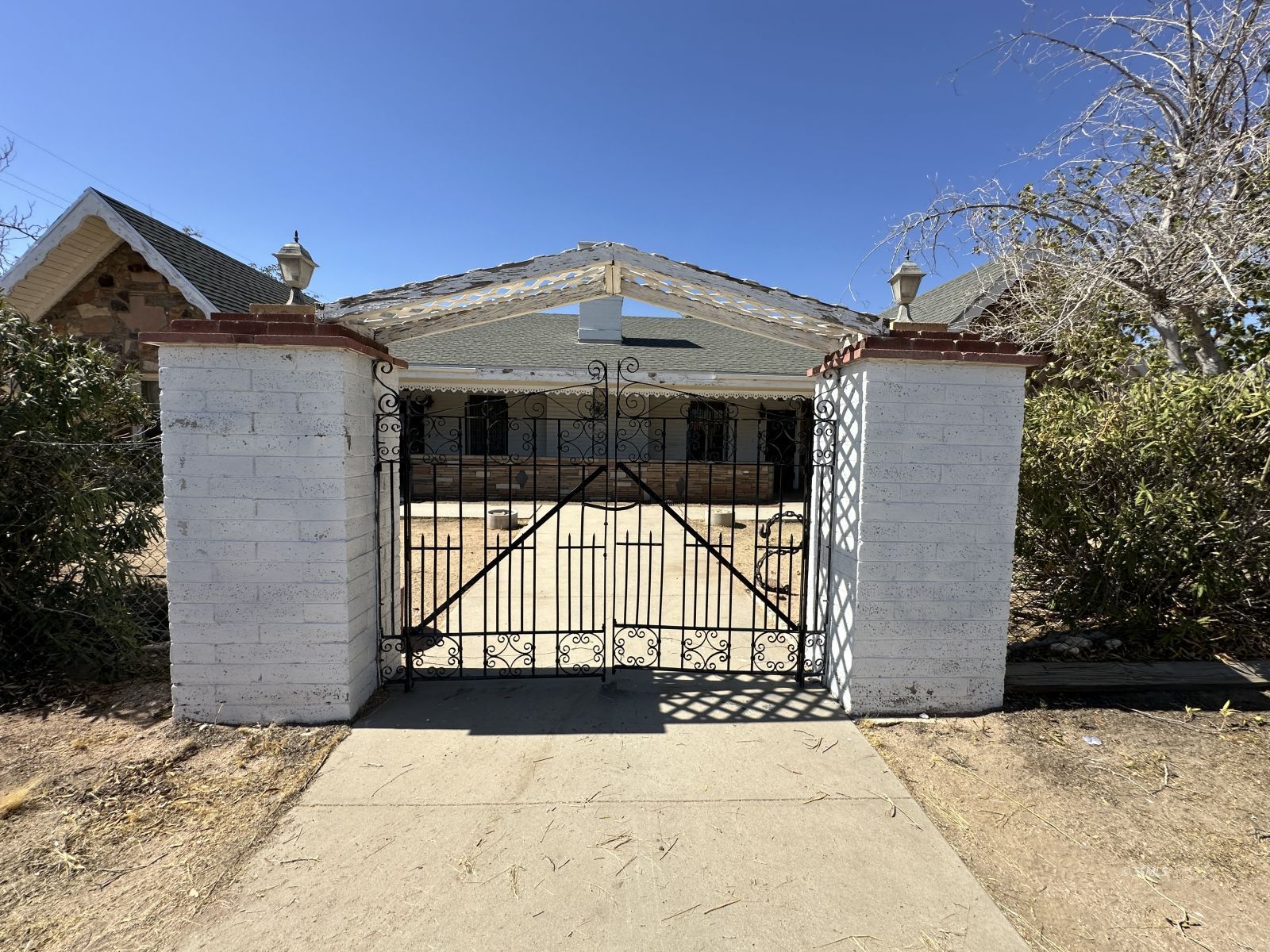 245 South Sanders Street Ridgecrest, CA 93555 - Photo 2 of 14 a view of entrance gate of a house