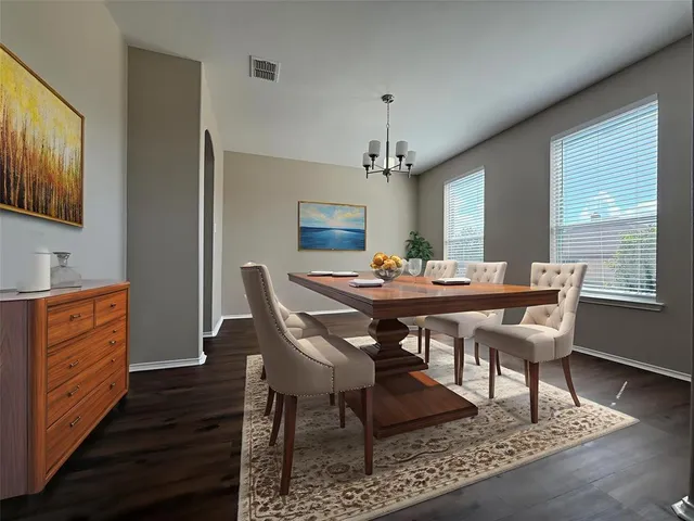 a view of a dining room with furniture window and wooden floor