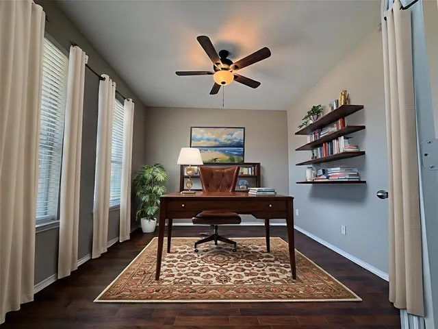 a living room with a couch and a window