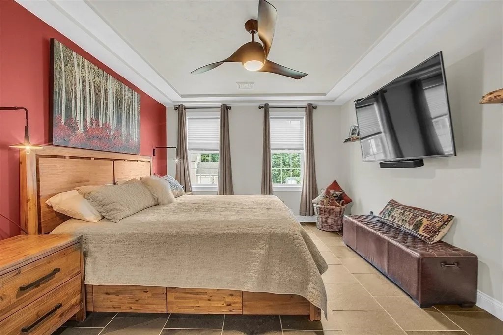 2 Morris Lane Rutland, MA 01543 - Photo 15 of 41 a bedroom with a large bed and a chandelier