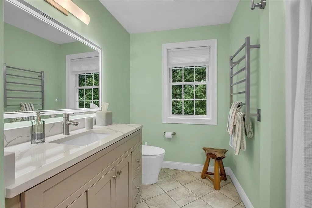 2 Morris Lane Rutland, MA 01543 - Photo 24 of 41 a bathroom with a granite countertop sink a toilet a mirror a window and shower