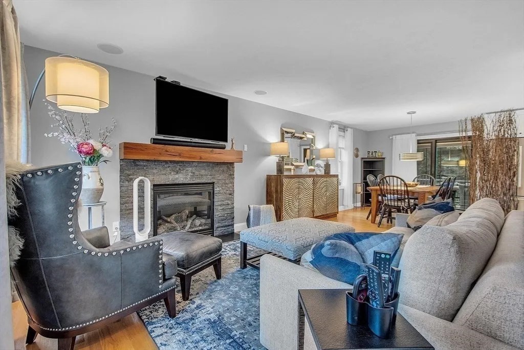 2 Morris Lane Rutland, MA 01543 - Photo 3 of 41 a living room with furniture a flat screen tv and a fireplace