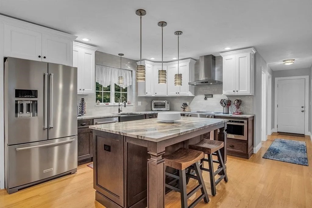 2 Morris Lane Rutland, MA 01543 - Photo 5 of 41 a kitchen with stainless steel appliances granite countertop a table chairs stove and refrigerator