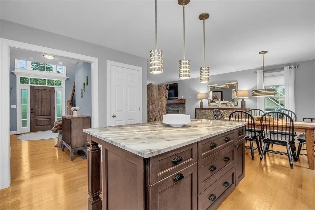 2 Morris Lane Rutland, MA 01543 - Photo 7 of 41 a kitchen with kitchen island granite countertop a stove a sink a dining table and chairs