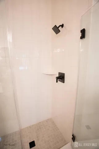 a kitchen with stainless steel appliances kitchen island a white counter space a sink and cabinets