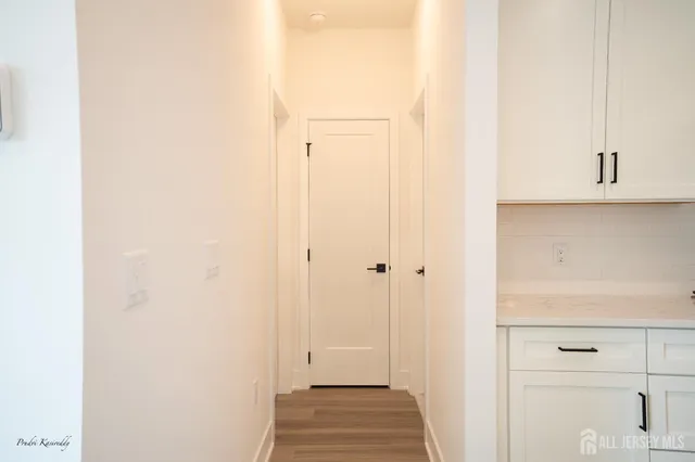 a bathroom with a sink a toilet a mirror and shower