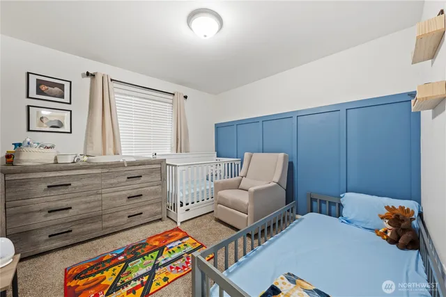 a bedroom with furniture and a window