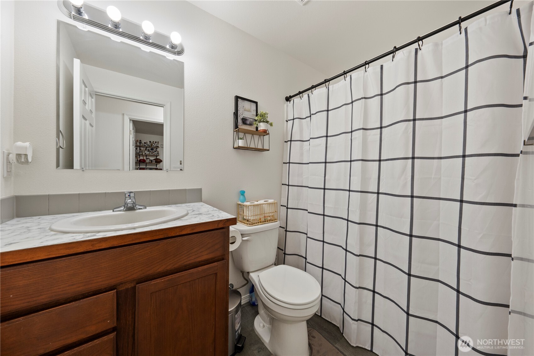 1045 Sandstone Street Othello, WA 99344 - Photo 18 of 20 a bathroom with a sink a toilet and mirror