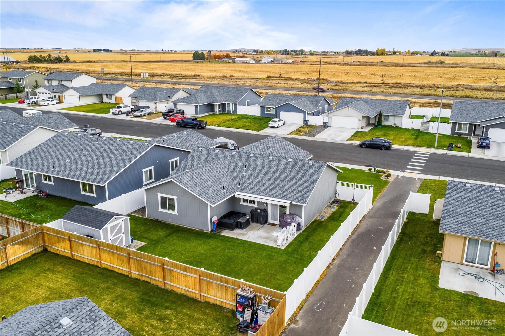 1045 Sandstone Street Othello, WA 99344 - Photo 2 of 20 an aerial view of a house with a ocean view