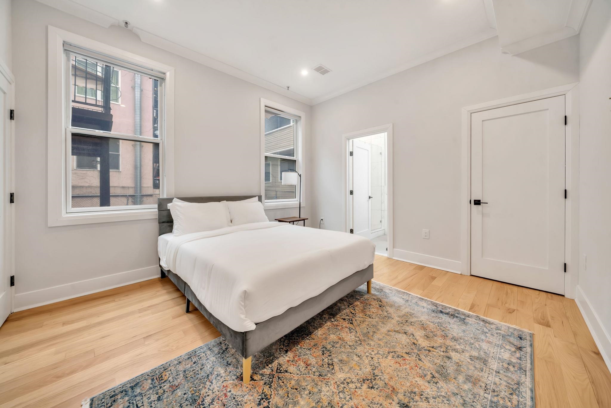 136 35th Street, Unit 1 Union City, NJ 07087 - Photo 14 of 18 a bedroom with a bed and a window