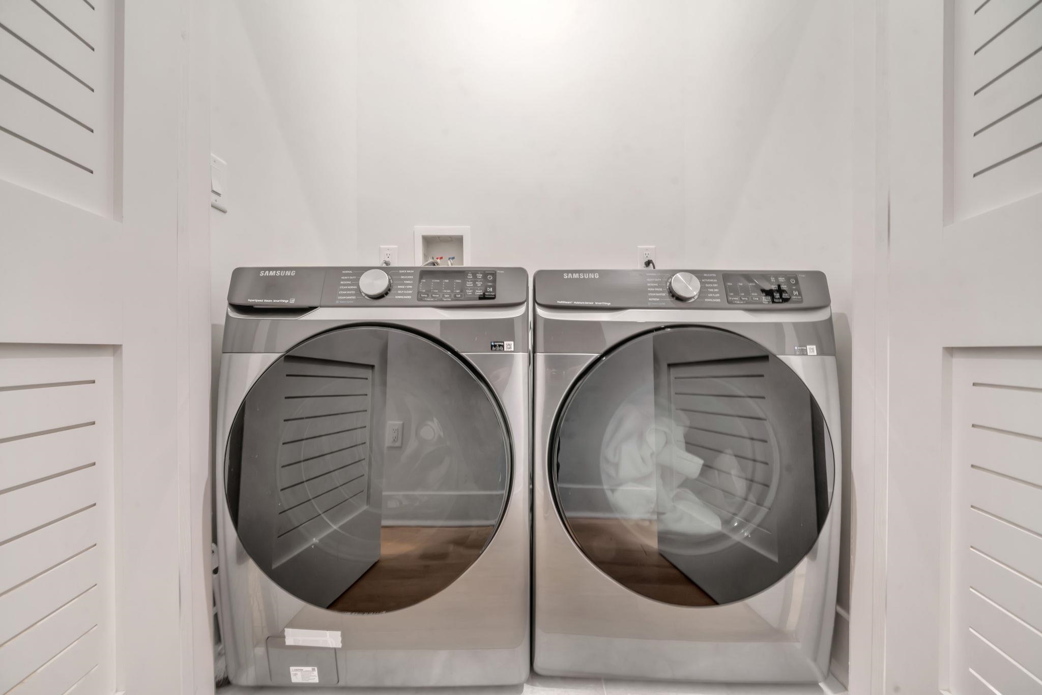 136 35th Street, Unit 1 Union City, NJ 07087 - Photo 15 of 18 a utility room with dryer and washer