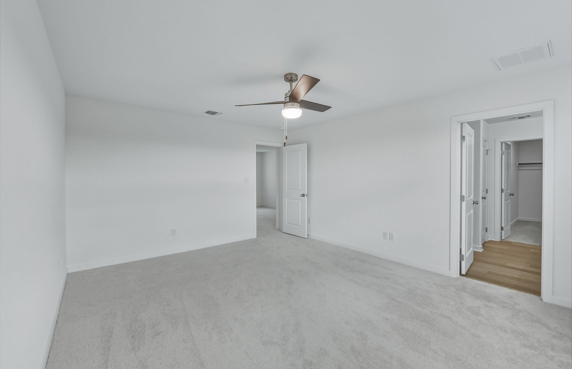 337 Sullivan Way Elgin, TX 78621 - Photo 9 of 25 a view of a room with a ceiling fan and carpet