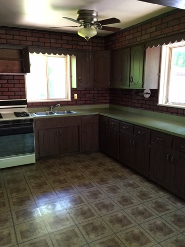 3 Crescent Road Lake Zurich, IL 60047 - Photo 4 of 10 a kitchen with granite countertop a stove and a sink