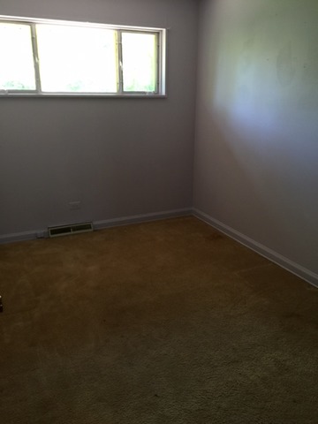 3 Crescent Road Lake Zurich, IL 60047 - Photo 7 of 10 an empty room with a window