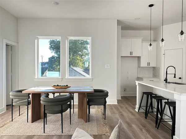 a view of a a dining room with a table and chairs