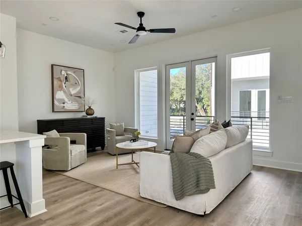 a living room with furniture and a large window