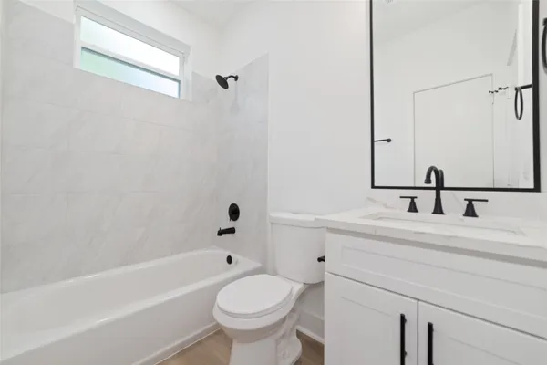 a bathroom with a sink and a bathtub