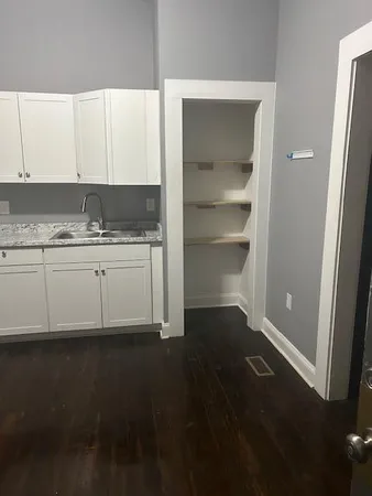 a kitchen with a sink and cabinets
