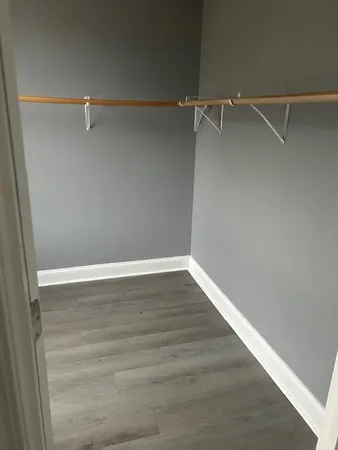 a view of an empty walk in closet
