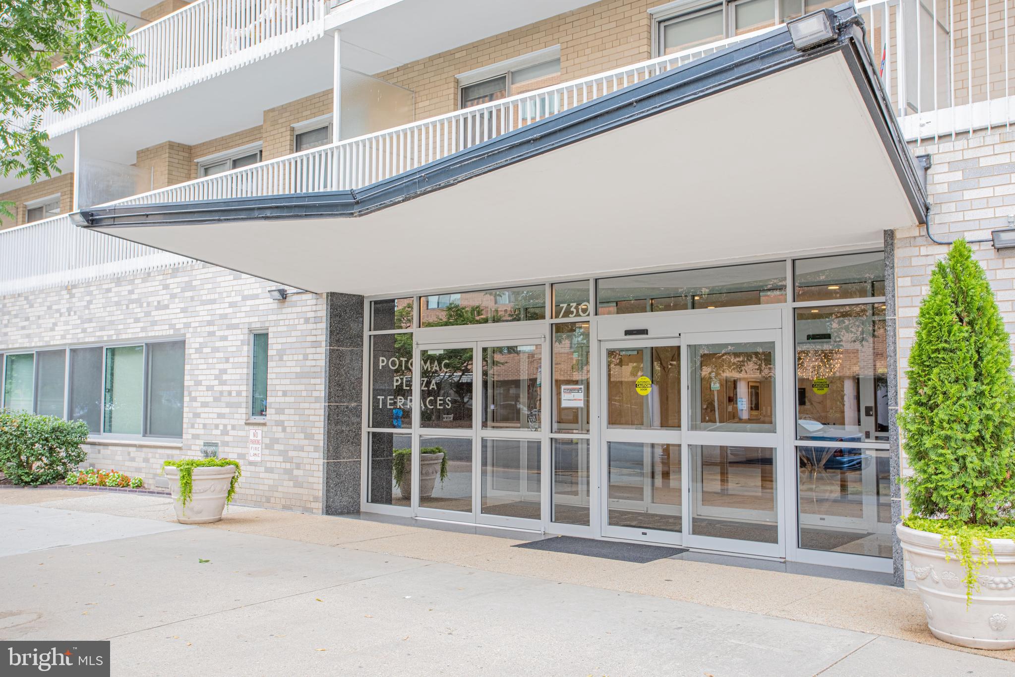 730 24th Street Northwest, Unit 708 Washington, DC 20037 - Photo 1 of 41 a front view of a building with a garden