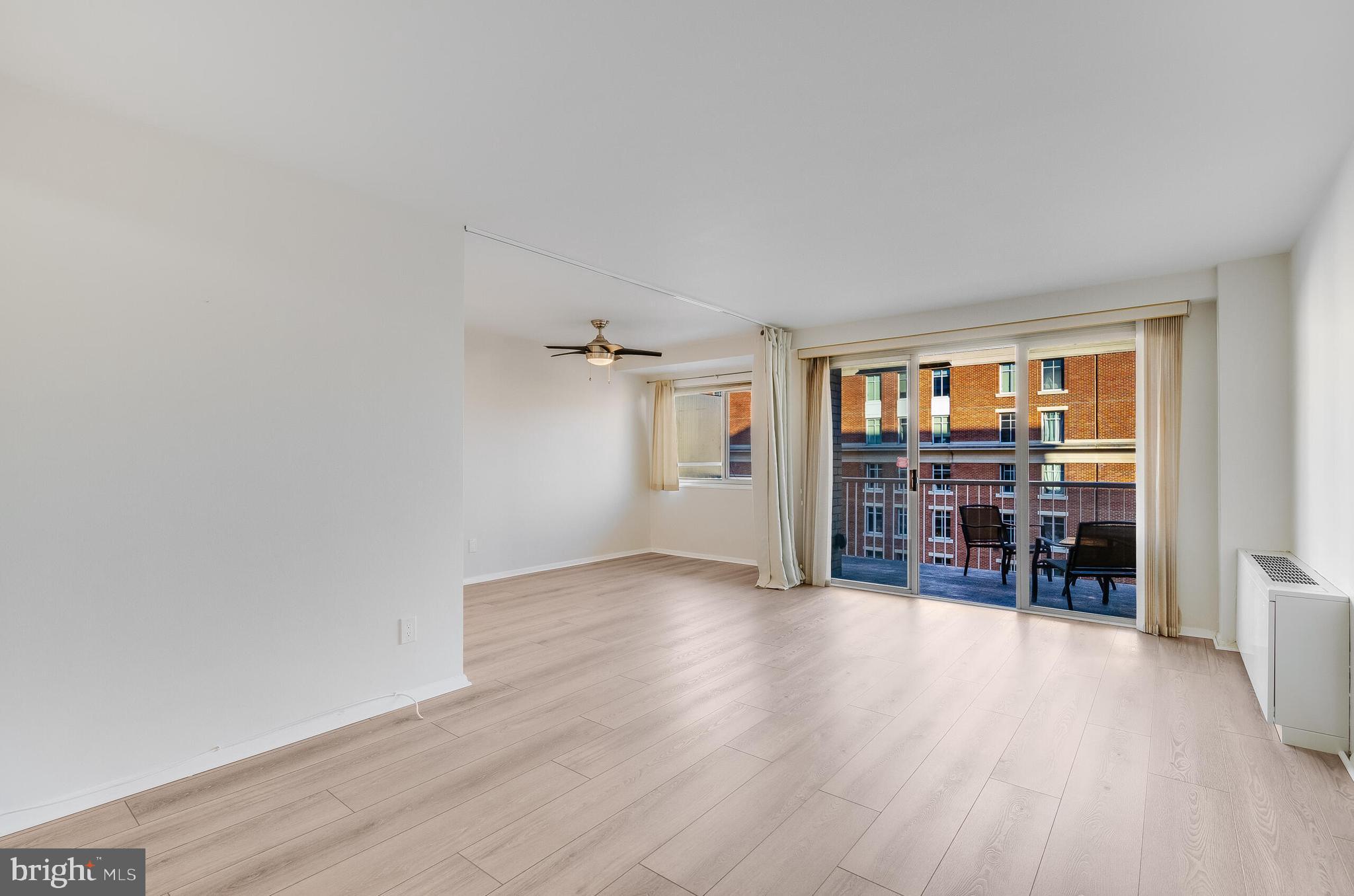 730 24th Street Northwest, Unit 708 Washington, DC 20037 - Photo 13 of 41 an empty room with wooden floor and windows