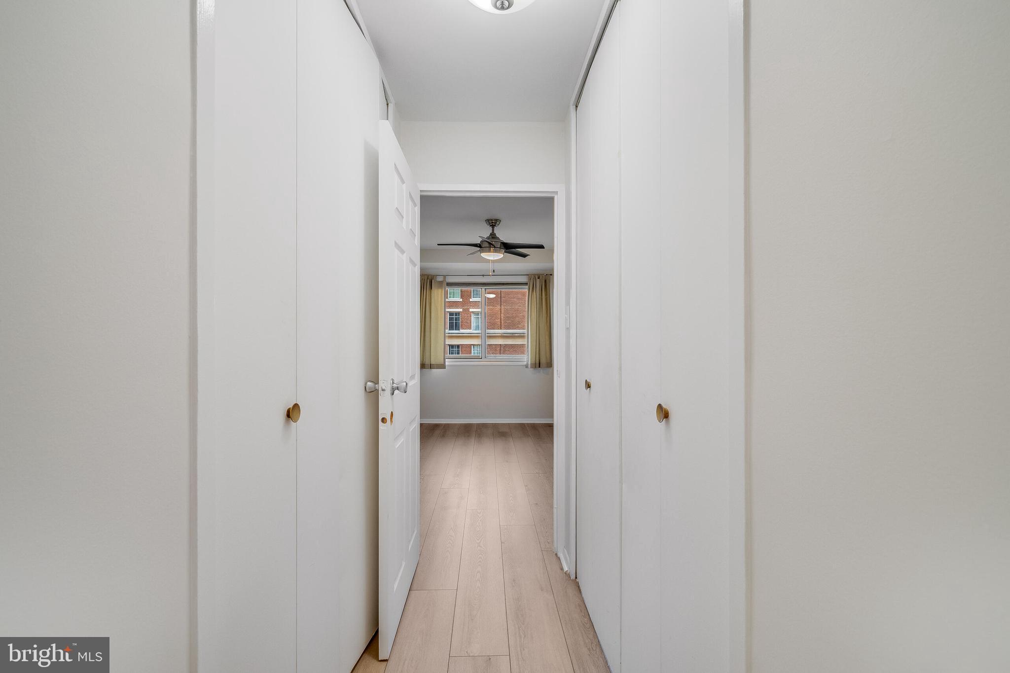 730 24th Street Northwest, Unit 708 Washington, DC 20037 - Photo 15 of 41 a view of a hallway with wooden floor and closet