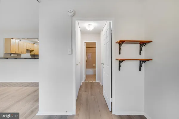 a view of a bathroom from a hallway