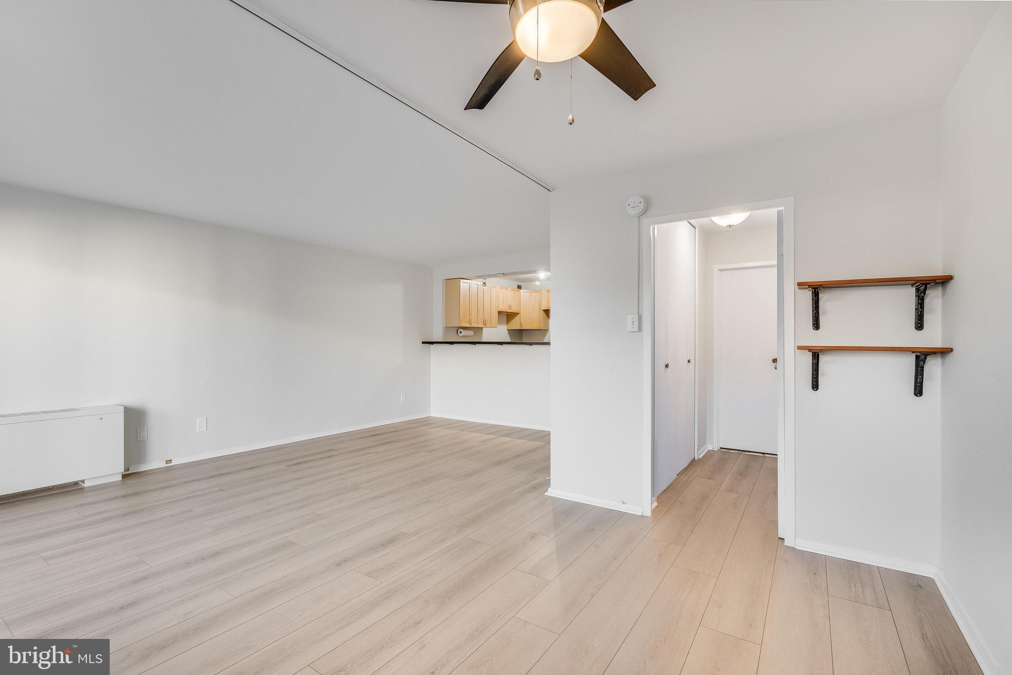 730 24th Street Northwest, Unit 708 Washington, DC 20037 - Photo 18 of 41 a view of a room with wooden floor closet and windows