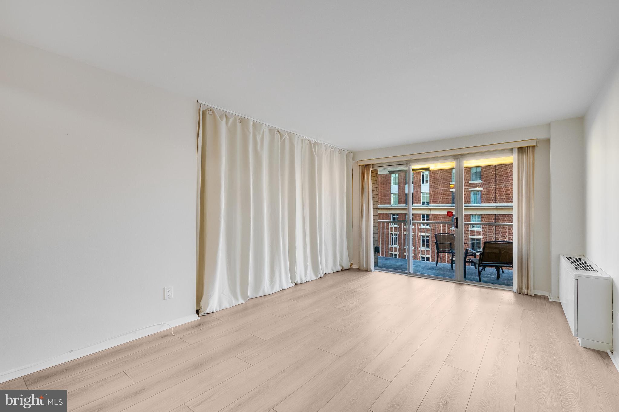 730 24th Street Northwest, Unit 708 Washington, DC 20037 - Photo 25 of 41 wooden floor in an empty room with a window