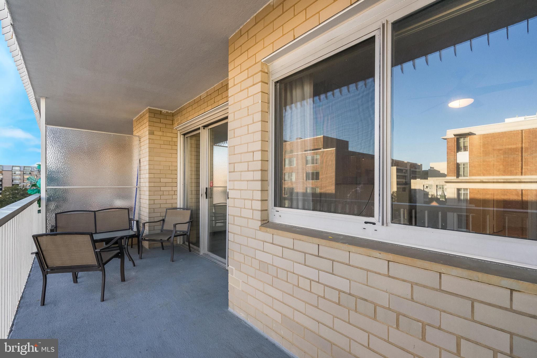 730 24th Street Northwest, Unit 708 Washington, DC 20037 - Photo 31 of 41 a view of a porch with a table and chairs