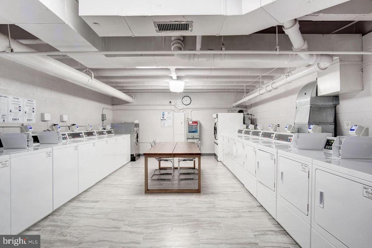 730 24th Street Northwest, Unit 708 Washington, DC 20037 - Photo 32 of 41 a kitchen with stainless steel appliances sink and cabinets