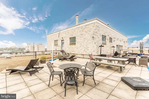 a living room with lots of furniture and view of living room