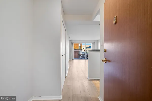 a view of a kitchen from the hallway