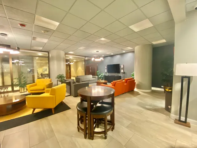 a view of a swimming pool with seating area