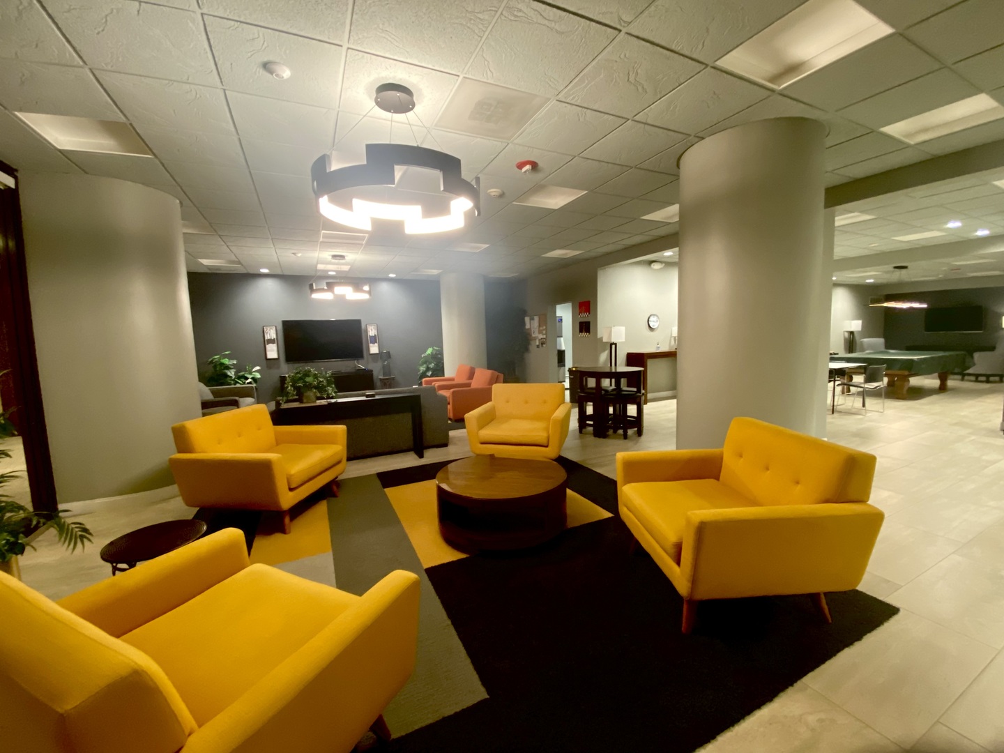 505 North Lake Shore Drive, Unit 3312 Chicago, IL 60611 - Photo 25 of 35 a living room with furniture kitchen view and a chandelier