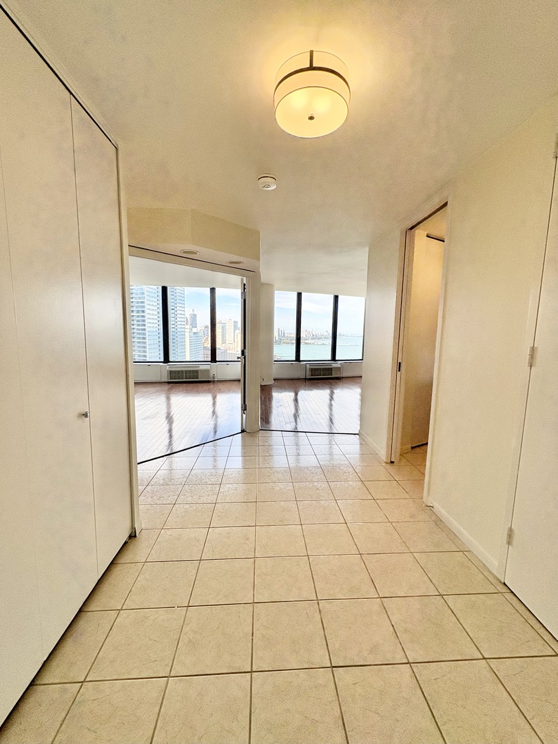 505 North Lake Shore Drive, Unit 3312 Chicago, IL 60611 - Photo 3 of 35 a view of an empty room and window