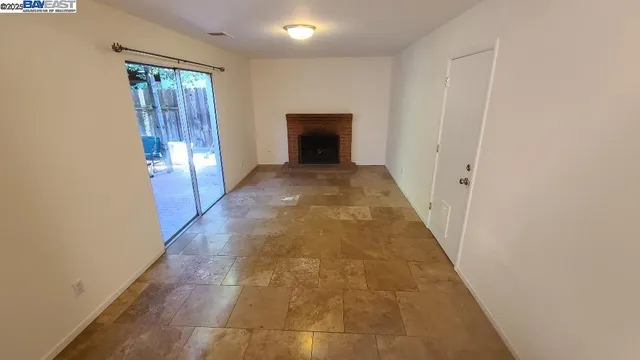 en empty room with wooden floor