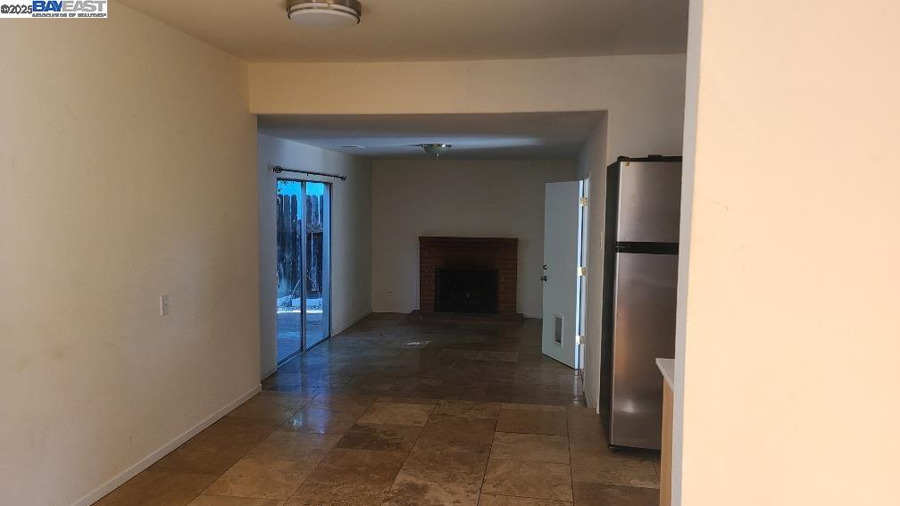 1501 L Street Davis, CA 95616 - Photo 6 of 23 a view of a hallway with wooden shelves