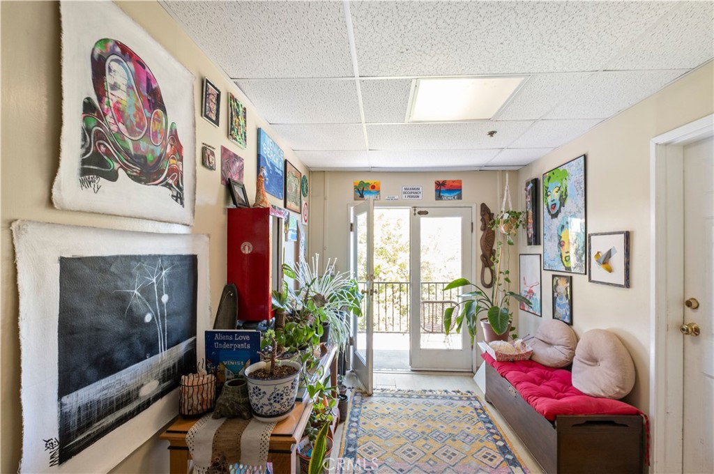 101 Dudley Avenue, Unit 315 Venice, CA 90291 - Photo 3 of 11 a living room with furniture and a fireplace