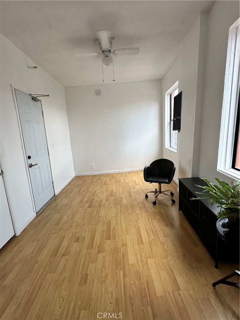 101 Dudley Avenue, Unit 315 Venice, CA 90291 - Photo 4 of 11 a bedroom with a bed and a chandelier