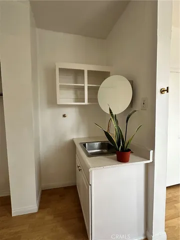 a kitchen with stainless steel appliances granite countertop a sink and a stove