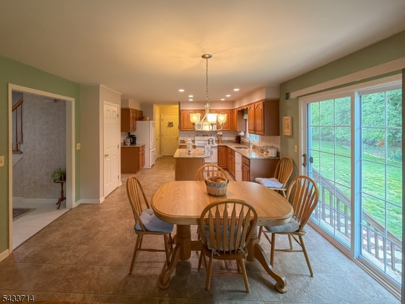 29 Lark Lane Oak Ridge, NJ 07438 - Photo 5 of 26 a view of a dining room with furniture window and outside view