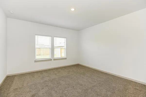 an empty room with closet area