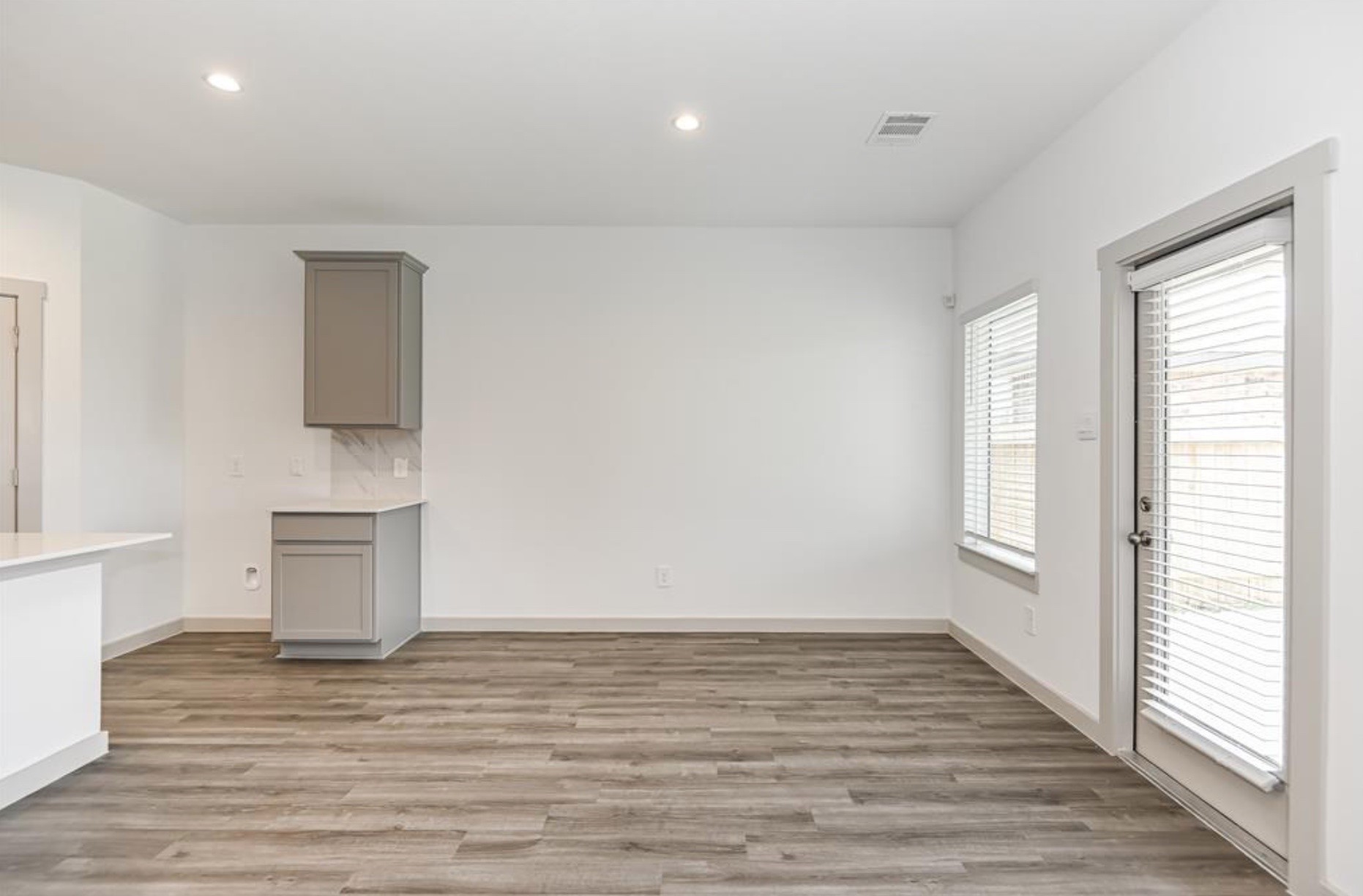 7918 Brumly Lane Rosharon, TX 77583 - Photo 10 of 34 a view of an empty room with wooden floor and a window